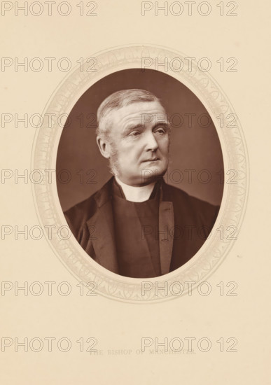 The bishop of Manchester, page, photomechanical print, photographer: Lock & Whitfield, cliché maker: anonymous, c. 1873 - in or before 1878, paper, Woodburytype, Woodbury Process, height 115 mm x width 89 mm, Person, James Fraser, archbishop, bishop, etc. (Roman Catholic), historical persons (portraits and scenes from the life) ((full) bust portrait), An oval sepia-toned portrait of an older man with short combed hair and sideburns, wearing a dark clerical collar and dark jacket, set against a plain background and surrounded by a decorative oval border on a light beige mount.