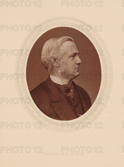 Professor Max Müller, page, photomechanical print, photographer: Lock & Whitfield, cliché maker: anonymous, c. 1873 - in or before 1878, paper, Woodburytype, Woodbury Process, height 115 mm x width 89 mm, Person, Max Müller, scholar, philosopher, historical persons (portraits and scenes from the life) ((full) bust portrait), A sepia-toned oval portrait of an older man shown in profile facing right, with light-colored hair combed back and sideburns, wearing a dark suit jacket, vest, high-collared shirt, and a cravat or tie fastened with a small decorative pin, set against a plain darker background and framed by an ornate patterned oval border on a lighter paper background.
