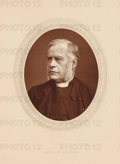 Bishop of Hereford, page, photomechanical print, photographer: Lock & Whitfield, cliché maker: anonymous, c. 1873 - in or before 1878, paper, Woodburytype, Woodbury Process, height 115 mm x width 89 mm, Person, James Atlay, archbishop, bishop, etc. (Roman Catholic), historical persons (portraits and scenes from the life) ((full) bust portrait), An oval-framed sepia portrait of an older man shown from the chest up, facing slightly to his right, with light-colored hair combed back and prominent sideburns, a high-collared garment visible at his neck and a dark coat with a button and lapel, set against a plain dark background and surrounded by a decorative patterned oval border on a light beige paper.