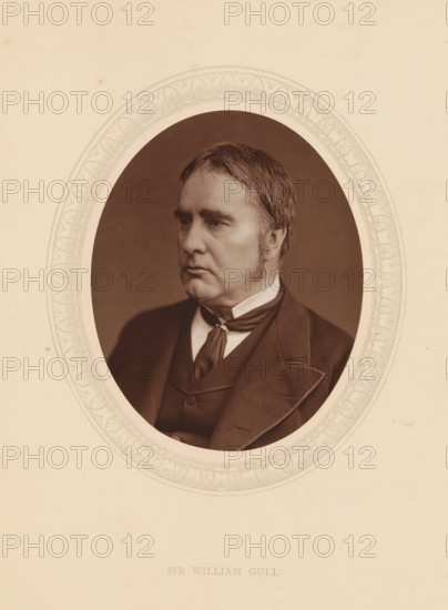 Sir William Gull, page, photomechanical print, photographer: Lock & Whitfield, cliché maker: anonymous, c. 1873 - in or before 1878, paper, Woodburytype, Woodbury Process, height 115 mm x width 89 mm, Person, William Gull, physician, doctor, historical persons (portraits and scenes from the life) ((full) bust portrait), An oval photographic portrait of a middle-aged man with short neatly combed hair and sideburns set against a dark background, the man wearing a dark suit jacket over a waistcoat and a necktie with a visible collar, the portrait surrounded by a decorative oval border on a pale textured background.
