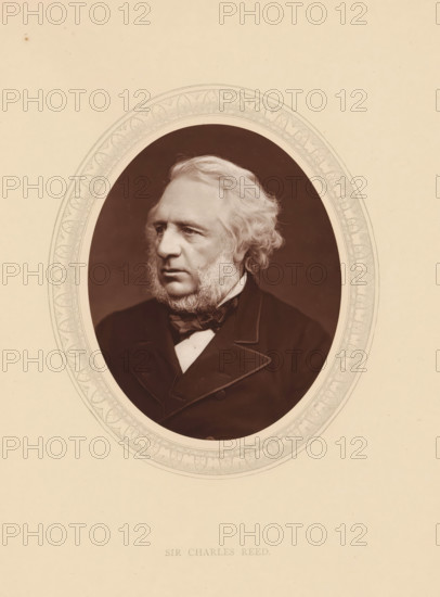 Sir Charles Reed, page, photomechanical print, photographer: Lock & Whitfield, cliché maker: anonymous, c. 1875 - in or before 1880, paper, Woodburytype, Woodbury Process, height 115 mm x width 89 mm, Person, Charles Reed, politician, eg party leader, historical persons (portraits and scenes from the life) ((full) bust portrait), An oval sepia portrait of an older man with wavy light hair and prominent sideburns, shown from the chest up and turned slightly to his left, wearing a dark coat with wide lapels, a bow tie, and a light shirt, set against a dark oval background and surrounded by a decorative oval border on a pale backing.