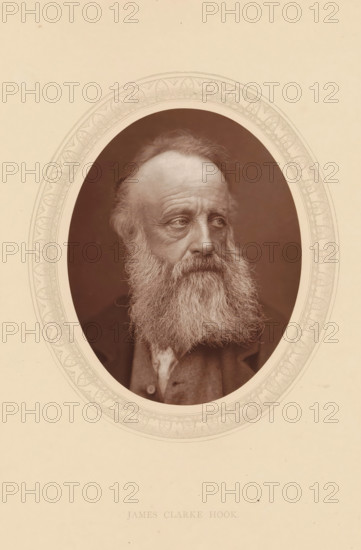 James Clarke Hook, page, photomechanical print, photographer: Lock & Whitfield, cliché maker: anonymous, c. 1875 - in or before 1880, paper, Woodburytype, Woodbury Process, height 115 mm x width 89 mm, Person, portrait, self-portrait of painter, historical persons (portraits and scenes from the life) ((full) bust portrait), An oval sepia photograph of an older man with a full long beard and mustache, receding hairline, and visible facial wrinkles, shown from the shoulders up and turned slightly to his right, set within a decorative oval border on a light beige background.