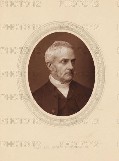 Very rev. Arthur P. Stanley, DD, page, photomechanical print, photographer: Lock & Whitfield, cliché maker: anonymous, c. 1875 - in or before 1880, paper, Woodburytype, Woodbury Process, height 115 mm x width 89 mm, Person, Arthur Penrhyn Stanley, theologian, historical persons (portraits and scenes from the life) ((full) bust portrait), An oval sepia portrait of an older man with light hair and sideburns set against a dark background, surrounded by an ornate decorative oval border on a light beige sheet, showing the man's head and upper torso dressed in a dark coat and a high white collar, his gaze directed slightly to the side.