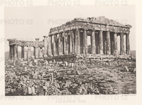 Parthénon nord, Parthenon on the Acropolis of Athens, page, photomechanical print, Athens, cliché maker: Dujardin, printer (person): Chardon-Wittmann, c. 1880 - in or before 1890, photographer, printer (person), Athene, Periféreia Protevoúsis, paper, photoaquatint, height 145 mm x width 215 mm, ruin of a building, architecture, temple, shrine, Greek religion, Acropolis, Parthenon, A wide sepia-toned photograph of an ancient stone temple ruin with a row of tall fluted columns supporting a partially intact entablature and pediment, set on a stepped platform surrounded by scattered broken stones and fragments across uneven rocky ground, with additional shorter columns visible to the left and an open sky above.