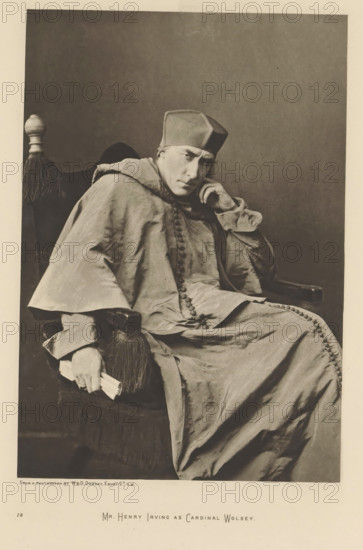 Mr. Henry Irving as Cardinal Wolsey, page, photomechanical print, photographer: Downey, William & Daniel, cliché maker: anonymous, c. 1883 - in or before 1893, paper, photoaquatint, height 216 mm x width 148 mm, Person, Henry Irving, portrait of actor, actress, A seated person wearing a long, flowing robe with visible buttons down the front and a square hat sits in a high-backed chair with a fringed armrest. The person rests one elbow on the chair arm and supports their head with a hand, looking slightly forward with a contemplative facial expression. The other hand holds a rolled object near the fringed armrest. The chair has a decorative finial at the top and dark upholstery. The background is plain and darker than the foreground, and the overall image is monochromatic with soft shadows and fabric folds visible across the robe.