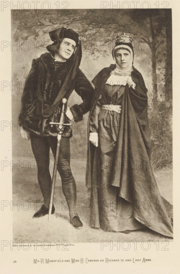 Mr R. Mansfield and Miss B. Cameron as Richard III and Lady Anne, page, photomechanical print, photographer: London Stereoscopic Company, cliché maker: anonymous, c. 1883 - in or before 1893, paper, photoaquatint, height 215 mm x width 147 mm, Person, Richard Mansfield, Beatrice Cameron, portrait of actor, actress, A sepia-toned photograph of two people in historical costume standing side by side against a painted backdrop with trees; on the left a person wearing dark fitted hose and shoes, a fur-trimmed tunic, a long draped hooded headpiece, and holding a long sword vertically with one hand resting on the hilt while looking slightly toward the right; on the right a person wearing a long flowing gown and cloak, a head covering with a crown, a decorative belt, and a white collar detail, holding part of the cloak with one hand and looking forward with a neutral expression.