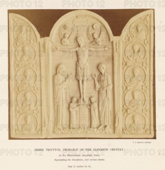 Greek triptych, probably of the eleventh Century, Ivory Greek triptych, depicting the crucifixion of Christ and saints, photograph, page, number: '(Class VII.) f.', inscription: 'In the Bibliothèque Impériale, Paris, Representing the Crucifixion, and various Saints. Size 11 inches by 9.5.', photographer: JA Spencer, c. 1850 - in or before 1856, paper, albumen print, height 126 mm x width 142 mm, piece of sculpture, reproduction of a piece of sculpture, Christ dead, particularities of crucifixion scenes, A carved triptych panel with a central arched section depicting a crucified figure with outstretched arms flanked by two standing figures and two smaller kneeling figures below, the central scene framed by tall rectangular borders and topped by two small winged figures near the arch, and two hinged side panels each containing vertical rows of circular medallion portraits of bearded figures in draped garments, all rendered in a pale stone tone against a darker rectangular background.
