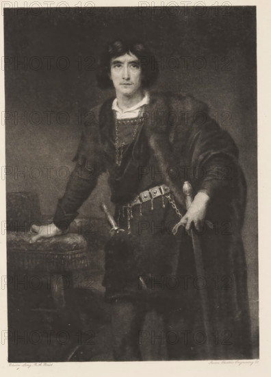 Henry Irving (Hamlet), reproduction, page, photomechanical print, photographer: Downey, William & Daniel, cliché maker: Swan Electric Engraving Co., after painting by Edwin Long, publisher: Virtue & Co., London, c. 1880 - in or before 1890, paper, photoaquatint, height 197 mm x width 140 mm, Person, portrait of actor, actress, A monochrome portrait of a person standing and facing forward, wearing a dark cloak over layered clothing with a lighter collar visible at the neck, a chain or decorative necklace draped across the chest, and a belt with ornamental square elements and hanging chains from which a sheathed dagger and another small weapon are suspended; one hand rests on an upholstered table or stool with fringe while the other grips the hilt of a sword, and the person has medium-length dark hair and a neutral facial expression against a plain, dark background.