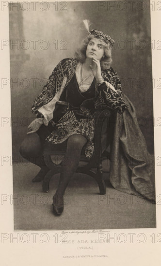 Miss Ada Rehan (Viola), page, photomechanical print, photographer: Alexander Bassano, cliché maker: anonymous, publisher: Virtue & Co., London, c. 1880 - in or before 1890, paper, photoaquatint, height 196 mm x width 122 mm, Person, Ada Rehan, portrait of actor, actress, A seated woman in a patterned costume with ornate embroidery and flowing sleeves looks upward with a hand resting against her chin, wearing a decorative cap with a feather and textured hair; she sits on a carved wooden chair with one leg crossed over the other, dark stockings and shoes visible, while a heavy draped fabric falls beside the chair and a soft, mottled backdrop fills the frame.