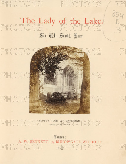 The lady of the lake, book, name: 'Bought of Willis and Sotheran Booksellers & Bookbinders Cha... Cross 42.', writer (clerical worker): Walter Scott, publisher: Alfred William Bennett, London, 1863, writer (clerical worker), textile materials, paper, linen (material), albumen print, color on cut, printing, height 201 mm x width 160 mm x thickness 30 mm, A faded cream page with a centered arched photograph showing an outdoor scene framed by tree trunks and foliage, stone ruins and a grassy ground, and an ornate arched architectural opening in the background with vertical bars and carved stonework; a person stands near the entrance inside the archway; the photograph has a rounded top and is surrounded by empty margins on the page.