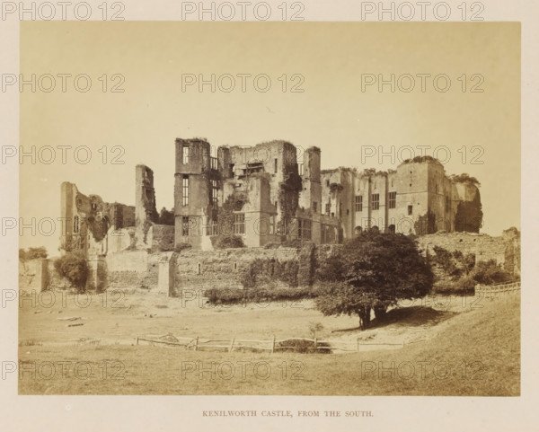 View of the ruins of Kenilworth Castle, Kenilworth Castle, from the south, photograph, page, c. 1862 - in or before 1872, photographer, Kenilworth, paper, albumen print, height 152 mm x width 204 mm, ruin of a dwelling, house, castle, A sepia-toned photograph of a large stone ruin atop a grassy rise, showing tall, weathered walls with window openings and jagged tops, sections covered in climbing vegetation, scaffolding against one central wall, a stone retaining wall along the slope, a cluster of trees and bushes at the base, a simple wooden fence in the foreground, and an expanse of open grass in front of the ruin beneath a pale sky.