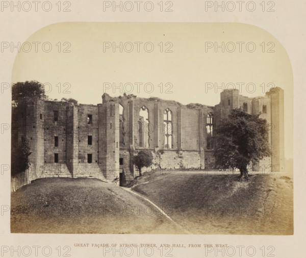 Great facade of Stong Tower, and Hall, from the west, View of the ruins of the facade of Kenilworth Castle, photograph, page, Kenilworth Castle, c. 1862 - in or before 1872, photographer, Kenilworth, paper, albumen print, height 150 mm x width 202 mm, ruin of a dwelling, house, castle, tower, clock tower, monumental adornment, façade (of house or building), A sepia-toned photograph showing the crumbling stone façade of a large building with tall, arched window openings and sections of ruined walls, set behind a grassy slope with a narrow worn path leading toward an entrance at the base of the structure, with trees flanking parts of the ruin and one prominent tree near the right side, and the image framed with rounded corners and a pale border.