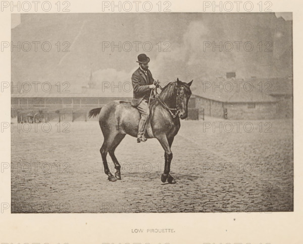 Low pirouette, Man on a horse in dressage, page, photomechanical print, cliché maker: Römmler & Jonas, Dresden, c. 1879 - in or before 1889, photographer, paper, collotype, photoprint, height 97 mm x width 137 mm, horse, riding a horse, ass, or mule, rider, horseman, head-gear: bowler hat, A sepia photograph of a man wearing a dark suit and bowler hat seated on a dark horse on a cobbled surface, the man holding reins and looking downward, the horse standing with one front leg lifted, a low fence and indistinct buildings visible in the background under a hazy sky.