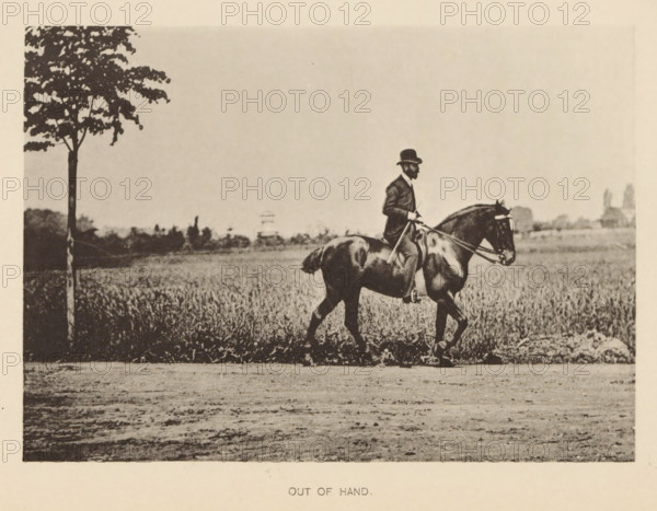 Out of hand, Man on a horse in front of a meadow, page, photomechanical print, cliché maker: Römmler & Jonas, Dresden, c. 1879 - in or before 1889, photographer, paper, collotype, photoprint, height 97 mm x width 136 mm, horse, riding a horse, ass, or mule, rider, horseman, head-gear: bowler hat, A sepia-toned photograph showing a man in a suit and hat riding a dark horse along a dirt path beside a field, the rider holding the reins and a riding crop, the horse moving with one front leg raised, a lone tree standing at the field edge on the left, low vegetation and distant trees along the horizon, and an open sky above.