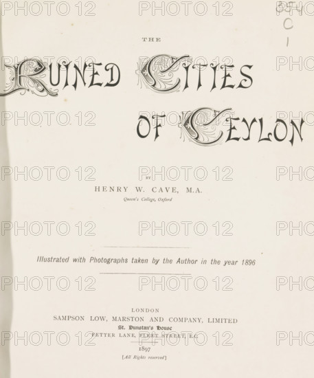 The ruined cities of Ceylon, book, name: 'J. Hanley Power', writer (clerical worker): Henry William Cave, publisher: Sampson Low, Marston & Company, London, 1897, writer (clerical worker), textile materials, pasteboard, paper, linen (material), printing, Woodbury engraving, color on cut, Woodbury engraving and color on cut, height 285 mm x width 225 mm x thickness 33 mm, A light-colored page with ornate decorative lettering across the top center and left, a pair of large ornate initials with swirling leaf-like embellishments, smaller plain characters between and below them, a short horizontal rule near the middle, a faint vertical smudge near the left edge, a narrow darker strip along the left margin, a few small scattered brown spots on the paper, and light printed lines and small printed blocks of text near the lower half of the page.