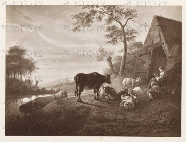 Photo reproduction of a print after a painting, depicting a herd with a shepherd in a meadow at twilight, photograph, reproduction, page, after print by anonymous, after painting by Aelbert Cuyp, c. 1859 - in or before 1869, photographer, after print by, paper, albumen print, height 129 mm x width 178 mm, meadow, pasture, sunset, cattle, A sepia-toned pastoral scene shows a gently sloping riverside with tall grasses in the foreground and a calm reflective body of water to the left, a cluster of trees along the distant bank, and layered clouds in the sky. On the near slope a standing cow faces toward a group of resting animals including a seated cow and several sheep lying and standing nearby. To the right a slanted wooden structure resembling a simple barn or shed leans with large planks and an open doorway, beside which a seated woman in a dress holds an object in her hand while a child sits on the ground nearby. A tall tree with spreading branches rises near the structure, and textur...