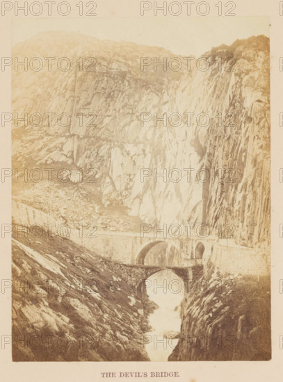 View of the Teufelsbrücke in the Gotthard Pass, The Devil's Bridge, photograph, page, photographer: Francis Frith, Gotthard Pass, c. 1855 - in or before 1865, Francis Frith, photographer, Gotthard pass, paper, albumen print, height 162 mm x width 122 mm, Photo opposite title page., bridge, A sepia-toned photograph showing a rocky mountainous landscape with steep cliffs and textured rock faces, a narrow river or stream running through a deep gorge, and two stone arch bridges spanning the water at different heights.