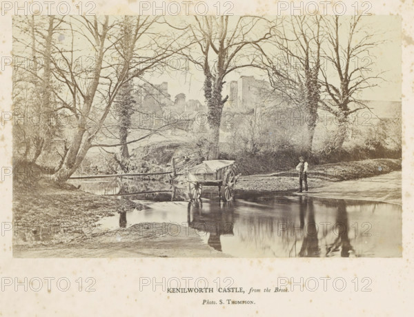 Kenilworth Castle, from the Brook, View of Kenilworth Castle, with a man with a handcart in the foreground, photograph, page, photographer: Stephen Thompson, c. 1854 - in or before 1864, Kenilworth, paper, albumen print, height 100 mm x width 161 mm, Photo opposite title page., hand-cart, ruin of a dwelling, house, castle, A faded sepia photograph shows a shallow stream bordered by grassy banks and leafless trees with tangled branches, several trunks close to the water and some covered in climbing vegetation, a wooden wheeled cart partially in the stream with its reflection visible on the water surface, a man standing at the water's edge wearing a cap and vest with his hands at his waist, a rustic wooden fence and a small footbridge near the trees, and distant stone ruins partially obscured by the trees.