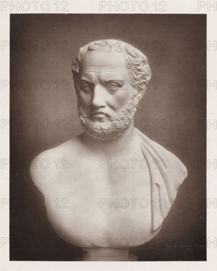 Portrait bust of Thucydides, page, photomechanical print, photographer: Charles David Winter, cliché maker: anonymous, c. 1868 - in or before 1878, paper, carbon print, height 184 mm x width 145 mm, sculpture, chest, bust, A photographic image of a marble bust showing the head and upper torso of a bearded male figure with short wavy hair and a draped garment over one shoulder, set against a dark background.
