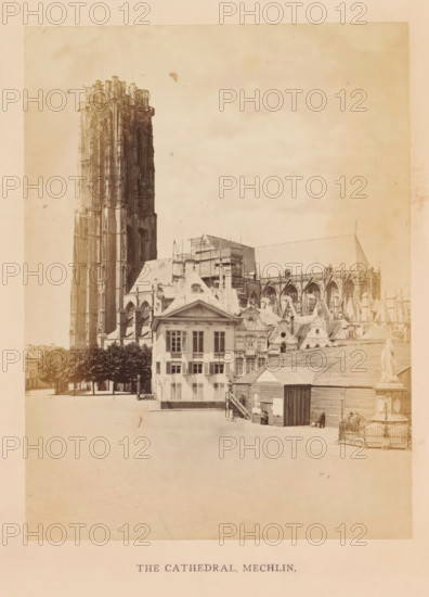 The cathedral, Mechlin, photograph, page, Mechelen, c. 1856 - in or before 1866, photographer, paper, albumen print, albumendruk, height 157 mm x width 118 mm, town hall, façade (of house or building), Sint-Romboutskathedraal, A sepia-toned photograph showing a large Gothic cathedral with a tall ornate tower rising on the left and the main nave with flying buttresses extending to the right, in front of which sit several multi-story classical buildings with gabled roofs and rows of windows, a small wooden structure with a pitched roof near the foreground, a statue on a pedestal enclosed by a low decorative fence to the right, a row of trees along a paved open square to the left, and a mostly empty open area occupying the lower portion of the image.