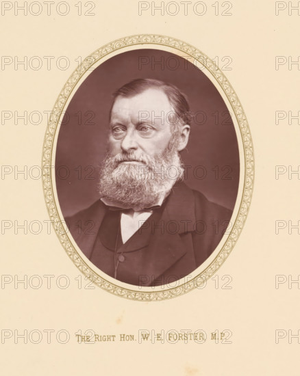 The right hon. WE Forster, MP, page, photomechanical print, c. 1875 - c. 1880, photographer, printmaker, paper, Woodburytype, height 110 mm x width 86 mm, Person, William Edward Forster, politician, eg party leader, An oval-framed sepia portrait of an older man with a full beard and mustache, neatly combed hair, and a serious facial expression, shown from the shoulders upward wearing a dark coat, waistcoat, and a white shirt collar, set against a dark background and surrounded by a decorative patterned border on a light beige mount.