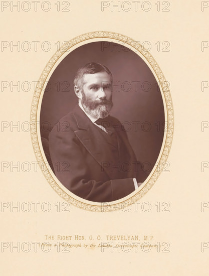 The right hon. GO Trevelyan, MP, page, photomechanical print, photographer: London Stereoscopic Company, London, c. 1875 - c. 1880, printmaker, paper, Woodburytype, Woodburytypie, height 110 mm x width 87 mm, Person, George Trevelyan, politician, eg party leader, An oval-framed sepia portrait of a bearded man wearing a dark suit and tie, set against a plain dark background, with a decorative border around the oval and a light beige surrounding mat.