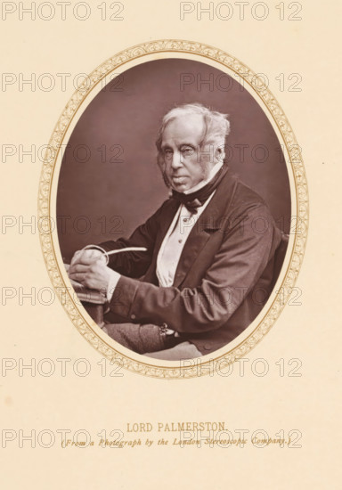 Lord Palmerston, Portrait of Henry John Temple, page, photomechanical print, photographer: London Stereoscopic Company, London, c. 1877 - c. 1882, printmaker, paper, Woodburytype, height 110 mm x width 86 mm, Person, Henry John Temple (3rd Viscount Palmerston), politician, eg party leader, An oval sepia photograph framed by a decorative border shows an older man seated in three-quarter view wearing a dark jacket, light waistcoat, white shirt, and a dark necktie; he has sideburns and thinning hair, and his hands rest on a surface holding a slim object.