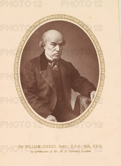 Sir William Jenner, Bart., KCB, MD, FRS, page, photomechanical print, photographer: Herbert Rose Barraud, London, c. 1876 - c. 1881, printmaker, paper, Woodburytype, height 111 mm x width 86 mm, Print on frontispiece., Person, William Jenner, physician, doctor, An oval sepia portrait shows an older man seated, wearing a dark suit with a high-collared shirt and a patterned neckerchief, his hair receding with wisps at the sides and a lined forehead, one hand resting on a patterned upholstered armrest and the other relaxed near his lap, the portrait framed by a decorative oval border set against a plain light background.