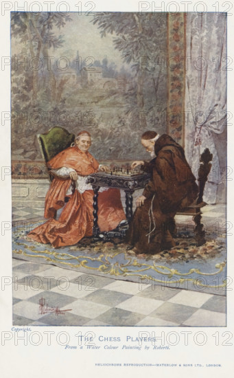 The chess players, reproduction, page, photomechanical print, printmaker: Waterlow & Sons Limited, London, after painting by Albert Pierre Roberti, c. 1889 - in or before 1899, photographer, paper, color autotype, heliochrome reproduction, height 168 mm x width 115 mm, organization, functions and dignitaries in Roman Catholic church, clergy in general, chess, exterior, representation of a building, An indoor scene shows two seated men at a small ornate table with a chessboard on it; one man wears a red robe and sits in a high green-upholstered chair with his hands near the board, the other wears a brown hooded robe and leans forward from a carved wooden chair while moving a piece. Behind them is a painted wall or tapestry depicting trees and distant buildings, and to the right a patterned curtain is pulled back. The floor features a patterned rug under the table and chairs and a checkerboard tiled area beyond, and decorative moldings and a floral border run along the lower wall.