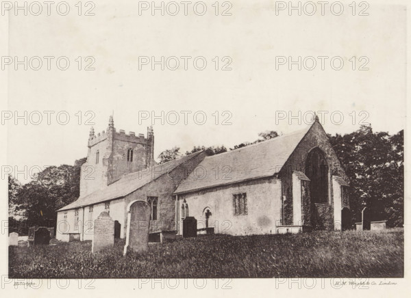 Aldingham church, View of Saintt Cuthbert's Church in Aldingham, page, photomechanical print, photographer: Wright, HM & Co., Aldingham, cliché maker: Wright, London, c. 1870 - in or before 1880, Wright, paper, heliotype, height 130 mm x width 187 mm, church (exterior), Cumbria, A sepia-toned photograph of a stone church with a pitched roof and a square tower with crenellations, set behind a grassy churchyard with several upright gravestones of varying shapes and sizes; the church has arched doorways and windows with leaded panes, a large pointed arch window on a gable end, buttresses, and textured stone walls, while trees form a dark backdrop behind the building and the sky above appears pale and mostly empty.