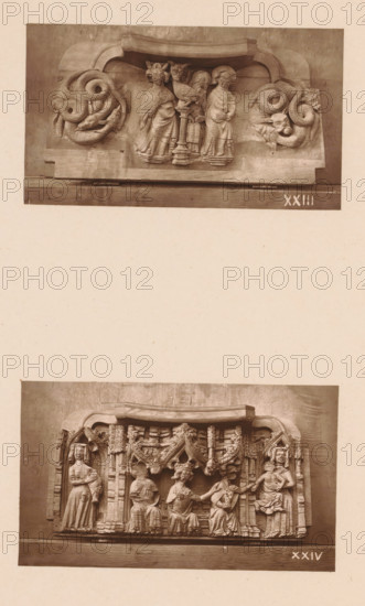 Two carvings in Worcester Cathedral, page, photomechanical print, Above Moses with the bronze serpent between two fantasy creatures, below the Adoration of the Magi., number: 'XXIII, XXIV', c. 1863 - in or before 1873, paper, Woodburytype, Woodburytypie, height 306 mm x width 244 mm, adoration of the kings: the Wise Men present their gifts to the Christ-child (gold, frankincense and myrrh), interior of church, anyone who is bitten by a snake is cured by looking at the brazen serpent, the serpent (or dragon) is usually depicted on a tau-shaped cross or on a pillar, carving, applied arts, A vertical image showing two separate sepia photographs of carved wooden panels mounted on a sheet. The upper photograph depicts a horizontal carved panel with a curved top edge, featuring three standing human figures in robes grouped around a central column topped by a bird, flanked on each side by coiled serpentine creatures with textured scales and horned faces. The lower photograph shows a wider hor...