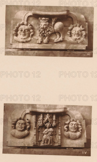 Two woodcarvings in Worcester Cathedral, page, photomechanical print, Above a crowned lion between two faces, below a musical angel between two faces., number: 'III, IV', c. 1863 - in or before 1873, paper, Woodburytype, Woodburytypie, height 306 mm x width 244 mm, beasts of prey, predatory animals: lion, interior of church, angels singing, making music, carving, applied arts, A sepia-toned photograph shows two carved wooden panels stacked vertically on a plain background. The upper panel features a central carved lion with a mane and curled tail flanked by two stylized human faces with wavy hair and rounded cheeks, all set within a rectangular frame with a curved top element. The lower panel displays a central carved figure with wings seated and holding an object, framed by ornate vertical architectural detailing, and is flanked by two similar rounded human faces with wavy hair; both panels show visible wood grain and carved texture.