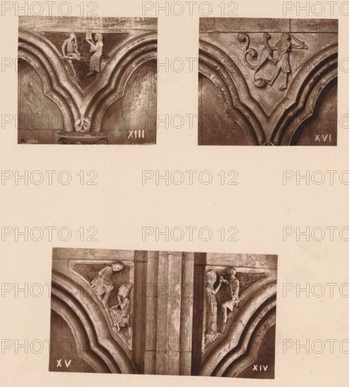 Three woodcarvings in an arcade of Worcester Cathedral, page, photomechanical print, Top left an architect shows his plans to a figure, top right a figure fighting a mythical creature, bottom a monk practicing a craft and a sculptor showing a sculpture., number: 'XIII, XVI', c. 1863 - in or before 1873, paper, Woodburytype, Woodburytypie, height 305 mm x width 244 mm, interior of church, man struggling with animals, carving, applied arts, architect offering design or model to patron, A paper with three sepia-toned photographs of carved stone architectural details mounted on it, showing the top pair of photographs side by side and a larger photograph centered below; the upper left photo displays a carved V-shaped arch with rounded mouldings and a small seated figure facing a standing figure on a ledge above the arch, the upper right photo shows a similar V-shaped arch with a carved figure holding a shield and another small decorative scroll motif above the arch, the lower photo shows a ...