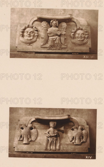 Two woodcarvings in Worcester Cathedral, page, photomechanical print, Above: a musical angel between two faces, below: a knight between two two-headed birds., number: 'XIII, XIV', c. 1863 - in or before 1873, paper, Woodburytype, Woodburytypie, height 306 mm x width 244 mm, interior of church, knight, angels singing, making music, carving, applied arts, A sepia photograph shows two separate carved wooden panels mounted on a neutral background, the upper panel featuring a central winged figure holding a small stringed instrument flanked by two rounded faces with stylized hair and decorative collars, and the lower panel depicting a central standing human figure with a trumpet-like instrument beside two symmetrical birds with detailed feathering, all carvings set within arched top frames and resting on flat bases.