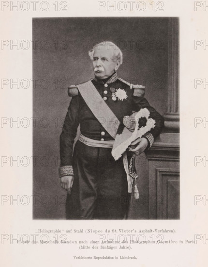 Portrait of Jacques Louis Randon, Porträt des Marschalls Randon nach einer Aufnahme des Photographen Cremière in Paris, page, photomechanical print, number: 'Tafel VI', inscription: 'Erste Proben der Generalstabskarte des kuk, 1869', photographer: Léon Cremière, Paris, cliché maker: anonymous, c. 1900 - in or before 1905, paper, collotype, photoprint, height 141 mm x width 102 mm, Print after page 484., Person, Jacques Louis Randon, commander-in-chief, general, marshal, A monochrome portrait of an older man standing in formal military dress, shown from head to mid-thigh, with light colored hair and a mustache, wearing a dark uniform with decorative shoulder epaulettes and a patterned sash across his chest, medals and a star-shaped decoration on his chest, ornate cuffs, and a sash around his waist; he holds a plumed bicorn hat with braided cords in one hand while the other hand rests at his side, and a carved wooden column or panel is visible beside him against a plain dark background, ...