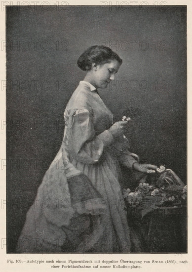 Portrait of a woman picking flowers, page, photomechanical print, inscription: 'Autotypie nach einem, auf nasser Kollodiumplatte', number: 'Fig. 109.', photographer: Joseph Wilson Swan, cliché maker: anonymous, c. 1900 - in or before 1905, paper, autotypie, height 145 mm x width 105 mm, flowers, adult woman, A monochrome image of a young woman in profile facing right, wearing a long dress with puffed sleeves and a high collar, her hair styled in a low bun; she is holding a small object near her chest with one hand while her other hand rests above a surface covered with flowers and fabric.