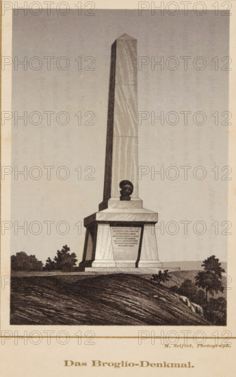 Das Broglio-Denkmal, Photo reproduction of a print of the obelisk for the Broglio brothers in the Monrepos park in Vyborg, reproduction, page, photomechanical print, photographer: M. Seifert, maker: Frey und Co. & G.H. Wiegand, Ph. (possibly), Frankfurt am Main, after print by anonymous, c. 1865 - in or before 1875, Frey und Co. & GH Wiegand, after print by, Hessen, paper, photolithography, height 141 mm x width 97 mm, garden, obelisk, needle, Leningradskaya, Vyborg, Monrepos, A tall stone obelisk rises from a tiered rectangular base situated on a sloping grassy hill, the obelisk showing subtle vertical striations and a pyramidal top, and a sculpted bust set into a recessed panel near the base, with trees and low shrubs on either side of the monument and textured ground in the foreground.