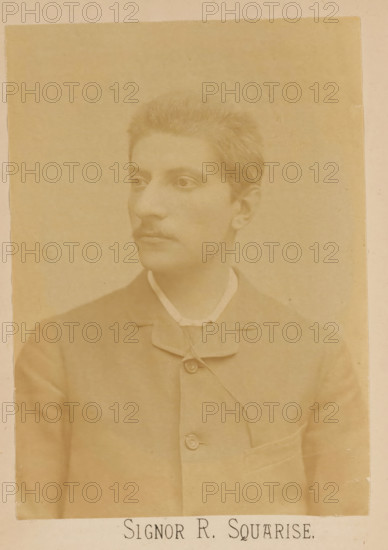 Signor R. Squarise, photograph, page, c. 1875 - in or before 1885, photographer, paper, albumen print, height 137 mm x width 97 mm, Person, Raffaello Squarise, portrait of composer, A sepia-toned portrait of a young person shown from the chest up, facing slightly to the left with short hair and a faint mustache, wearing a high-collared shirt under a buttoned jacket with a visible pocket and buttons, set against a plain background.