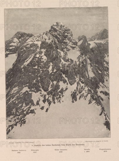 View of the Dachstein Mountains, Ansicht des hohen Dachstein vom Gipfel des Thorstein, page, photomechanical print, number: '11.', photographer: Oskar Simony, Salzburg (city), cliché maker: Angerer & Göschl, C., 1888-05-20, paper, autotypie, height 185 mm x width 147 mm, mountain-range, snow peaks, Dachstein (Salzburg), A monochrome image of a jagged mountain range with steep rocky faces and patches of snow, showing a central prominent peak surrounded by smaller ridges and sharp cliffs, with a pale sky above and a lighter foreground area at the base of the mountains, all framed by a thin rectangular border and set on a textured background.