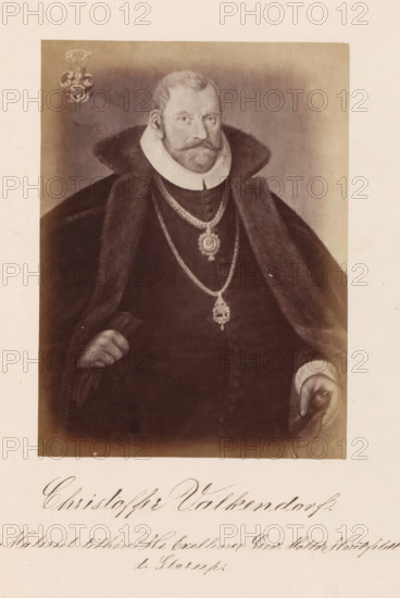 Christoffer Valkendorf, Photographic reproduction of a painting, depicting a portrait of Christoffer Valkendorff, photograph, reproduction, page, inscription: 'Maleriet tillhører Hs. Exellence Grev Moltke Hvitfeldt til Glorup.', photographer: Julius Wulff, after painting by anonymous, c. 1858 - in or before 1862, paper, albumen print, albumendruk, height 166 mm x width 124 mm, Person, Christoffer Valkendorff, official, civil servant, functionary (in general), A sepia-toned portrait of a man shown from waist up wearing a dark heavy cloak with a fur collar and a high white ruff around his neck, a trimmed beard and mustache, and short hair; he wears multiple ornate chains and medallions over his chest and holds a cap or hat in one gloved hand while the other hand rests near his side; a decorative crest appears in the upper corner of the framed image and a pale border surrounds the portrait.