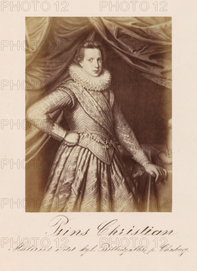 Prince Christian, Photographic reproduction of a painting, depicting a portrait of Crown Prince Christian of Denmark and Norway, photograph, reproduction, page, inscription: 'Maleriet i det kgl. Billedgalleri paa Christiansborg Slot.', photographer: Julius Wulff, after painting by anonymous, c. 1858 - in or before 1863, paper, albumen print, albumendruk, height 166 mm x width 123 mm, Person, Christian of Denmark and Norway, crown prince, A sepia-toned portrait of a young person wearing ornate period clothing, including a high ruffled collar and a patterned, textured doublet with puffed sleeves and a wide skirt, standing in front of draped fabric; one hand rests on the hip and the other touches a surface where a round hat with decorative trim is placed, and the subject has short wavy hair and a neutral facial expression.
