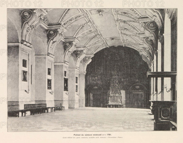 Pohled do vystavni mistnosti z r. 1791, Interior of the Clementinum in Prague, page, photomechanical print, Clementinum, cliché maker: Carl Bellmann, Prague, c. 1888 - in or before 1893, photographer, paper, autotypie, height 190 mm x width 258 mm, permanent exhibition, museum, interior, representation of a building, A large interior space with a high vaulted ceiling decorated with ornate curved moldings and sculpted details, a row of tall arches along one side, framed paintings mounted on the walls between the arches, long wooden benches and a few chairs lined against the wall, wall-mounted candle sconces, a dark recessed area at the far end containing a tall decorative sculpted structure on a raised base, and a wooden partition with paneling visible on the right edge.