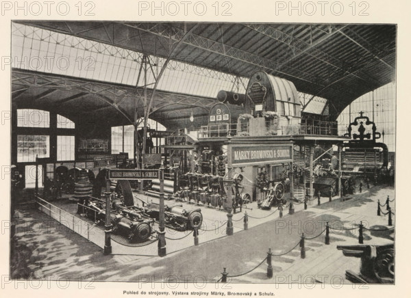 Interior of an engine room with an exhibition by Marek, Bromovský and Schulz, Pohled do strojovny. Výstava strojirny Marky, Bromovský a Schulz, page, photomechanical print, Prague, cliché maker: Carl Bellmann, c. 1890 - in or before 1895, photographer, paper, autotypie, height 176 mm x width 258 mm, interior, representation of a building, machines, parts of machines, tools and appliances, A large interior space with a high arched roof supported by metal trusses and tall windows along the upper walls, containing an exhibition of heavy industrial machinery arranged on raised platforms and behind low railings, including large cylindrical and gear-like components, pumps, valves, and interconnected pipes, with a prominent arched machine housing on a raised platform and multiple signs mounted above equipment, walkways and stair railings around the displays, scattered freestanding posts connected by ropes marking a pedestrian path, shadowed floor patterns, and a few small human figures near t...