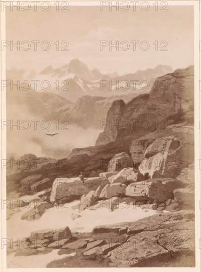 Photo reproduction of a painting of a view from the Furka Pass to the Finsteraarhorn, Auf der Furka. Gegen das Finsteraarhorn gesehen, photograph, reproduction, page, number: '10.', publisher: Friedrich Bruckmann, after painting by Gustav Paul Closs, c. 1863 - in or before 1873, photographer, paper, albumen print, height 202 mm x width 144 mm, mountain-range, snow peaks, predatory birds, Alps, Bernese Alps, Furka pass, Finsteraarhorn, A sepia-toned mountain landscape showing layered rocky cliffs and boulders in the foreground and middle distance, with a high, sheer rock face on the right and rugged peaks and snowfields fading into mist in the background; a lone bird is visible in flight above the misty valley and a small solitary figure stands atop a large foreground rock, while patches of snow and scattered stones cover the ground.