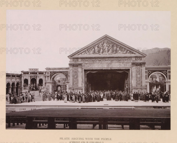 Pilate arguing with the people (Christ or Barrabas?), page, photomechanical print, inscription: 'Gemeinde Oberammergau Passionsspiel 1890', photographer: Carl Stockmann, Oberammergau, cliché maker: anonymous, c. 1885 - in or before 1890, Bavaria, paper, collotype, photoprint, height 167 mm x width 227 mm, group of actors, troupe, actors on the stage, choice between Christ and Barabbas, A wide stage set resembling a classical building facade with a large triangular pediment decorated with sculpted figures sits at center, flanked by arches and columns with ornate detailing; a group of costumed performers stand across the stage in various poses and garments, some on steps and balconies at left while others form lines and clusters in front of the central opening, and empty tiered seating fills the foreground.