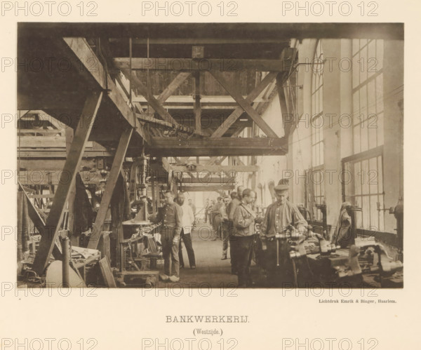 Machine shop. (West side), Interior with employees of the machine factory of Gebroeders Stork & Co, page, photomechanical print, number: 'No. 10.', Hengelo (Overijssel), maker: Emrik & Binger, Haarlem, c. 1884 - in or before 1894, photographer, paper, collotype, light print, height 146 mm x width 213 mm, factory-building, factory-interior, machine shop, A sepia-toned photograph of an industrial workshop interior showing a long narrow space with high windows along one side and large wooden beams and trusses crossing overhead, a row of men standing and working at benches and machinery along the center and right side, various metalworking tools and mechanical parts on the benches and floor, visible belts and pulleys, shelving and stacked materials along the left side, overhead structural timbers and cross braces, men wearing work clothes and caps, and diffuse light coming through the tall multi-pane windows.