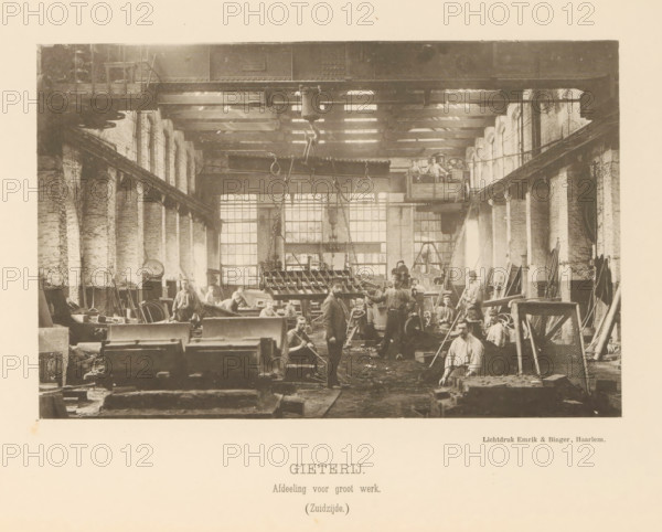 Foundry. Large-scale work department. (South side), Interior with employees of the foundry of the machine factory of Gebroeders Stork & Co, page, photomechanical print, number: 'No. 4.', Hengelo (Overijssel), maker: Emrik & Binger, Haarlem, c. 1884 - in or before 1894, photographer, paper, collotype, photogravure, height 131 mm x width 203 mm, factory-building, workshop, A wide interior view of a large industrial workshop with tall arched windows along both side walls, wooden roof beams and a large overhead crane with chains and hooks suspended above the workspace; numerous workers in period clothing stand and sit among heavy machinery, metal parts, tools, crates and workbenches scattered across the floor; a raised platform with additional workers and equipment is visible toward the back right, and ladders, racks and various long metal rods lean against the right wall; light filters through the windows creating bright rectangles on the back wall and work area.