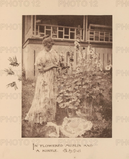 Woman in a garden with poppies, page, photomechanical print, inscription: 'In Flowered Muslin and a Kirtle', photographer: Mary Bartlett, United States of America, cliché maker: anonymous, c. 1884 - in or before 1894, North America, paper, photoaquatint, height 165 mm x width 122 mm, adolescent, young woman, maiden, flowers: poppy, A sepia-toned photograph shows a young woman standing in a garden beside tall flowering stalks with round blossoms, wearing a light-colored, patterned dress with puffed sleeves and a gathered bodice, her hair styled up and her gaze directed downward toward her hands which are holding a flower; behind her is a railing and part of a building with vertical panels, and to the left of the photograph there are three small illustrated bees arranged vertically, while in the foreground lower right a large fabric flower with layered petals lies on the grass.