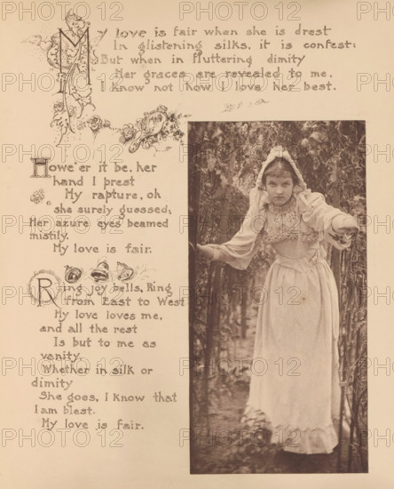 Portrait of an unknown girl with a white dress and a white bonnet in a garden, page, photomechanical print, photographer: Mary Bartlett, United States of America, clichémaker: anonymous, c. 1884 - in or before 1894, North America, paper, photoaquatint, height 169 mm x width 85 mm, girl (child between toddler and youth), dress, gown, A sepia-toned page shows an ornate decorative border and floral illustrations on the left and a tall rectangular photograph on the right of a young girl standing among foliage; she wears a light-colored long dress with ruffled trim and a bonnet with ties, her arms are extended outward with one hand touching a branch, and her expression is neutral while she looks toward the camera, with trees and leaves filling the background.