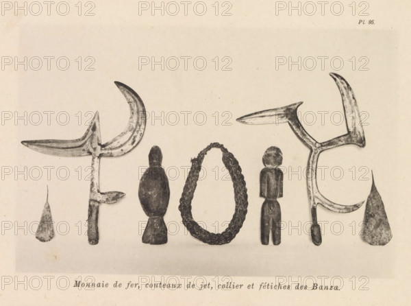 Money, throwing knives, necklace and fetishes of the Banza, a necklace and idols of the Banza (former title), a necklace and religious images of the Banza, page, photomechanical print, number: 'Pl. 86.', photographer: Franz Thonner, clichémaker: Stengel & Markert, Dresden, 1896, Saxony, paper, collotype, photoprint, height 110 mm x width 160 mm, sculpture, tools, aids, implements, crafts and industries: knife, necklace, Several carved objects arranged side by side against a light background, including pairs of curved, crescent-shaped metal pieces with textured surfaces and pointed ends, teardrop-shaped flat pieces with mottled patterns, a braided loop with tightly woven strands forming an oval, and two carved wooden figures with simplified rounded heads and elongated bodies.